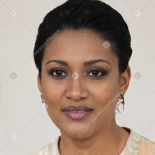 Joyful black young-adult female with short  black hair and brown eyes