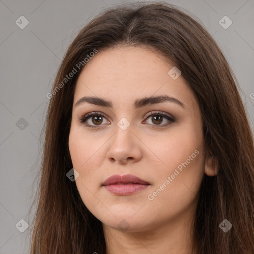 Neutral white young-adult female with long  brown hair and brown eyes