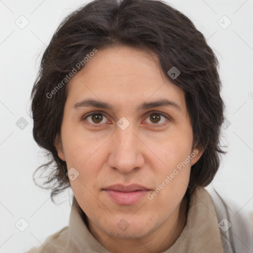 Joyful white adult female with long  brown hair and brown eyes