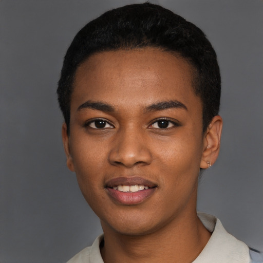 Joyful black young-adult male with short  black hair and brown eyes