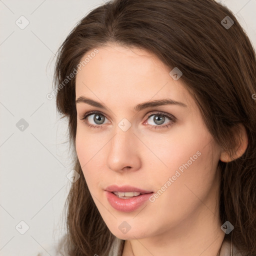 Neutral white young-adult female with long  brown hair and brown eyes