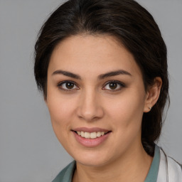 Joyful white young-adult female with medium  brown hair and brown eyes