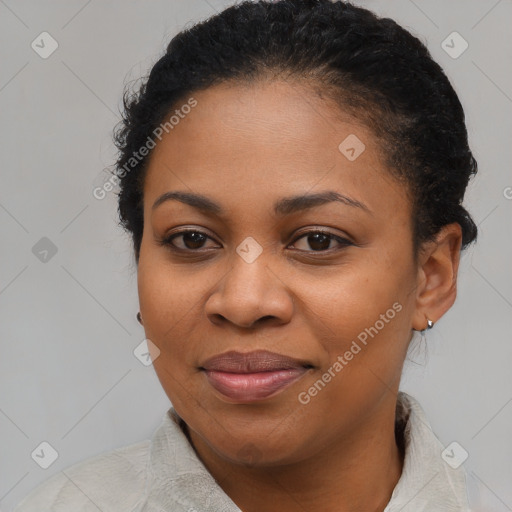 Joyful black young-adult female with short  black hair and brown eyes