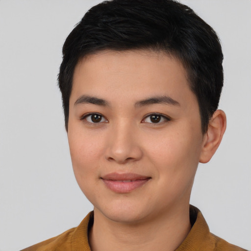 Joyful asian young-adult female with short  black hair and brown eyes
