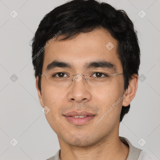 Joyful asian young-adult male with short  black hair and brown eyes