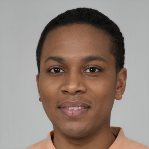 Joyful black young-adult male with short  black hair and brown eyes