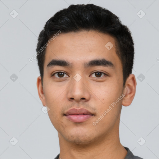 Neutral latino young-adult male with short  black hair and brown eyes