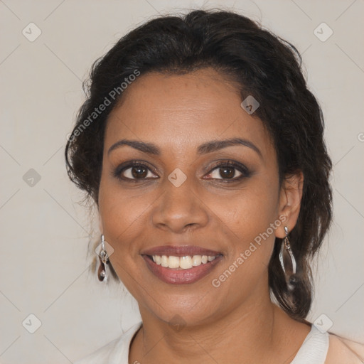 Joyful black adult female with medium  brown hair and brown eyes