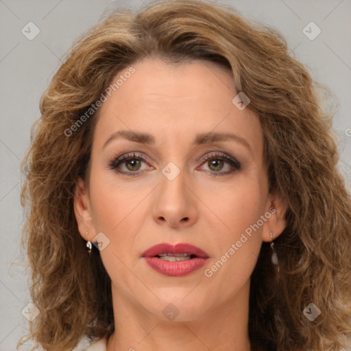 Joyful white adult female with long  brown hair and brown eyes