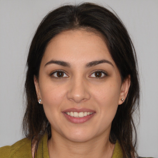 Joyful white young-adult female with medium  brown hair and brown eyes