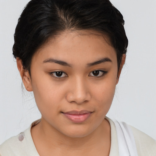 Joyful latino young-adult female with medium  brown hair and brown eyes