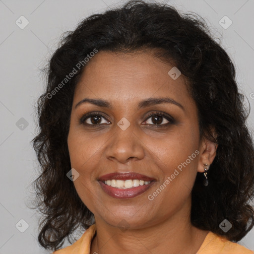 Joyful black adult female with medium  brown hair and brown eyes