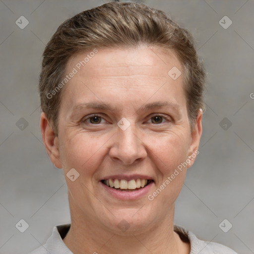 Joyful white adult female with short  brown hair and grey eyes