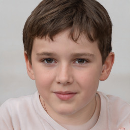 Joyful white child male with short  brown hair and brown eyes