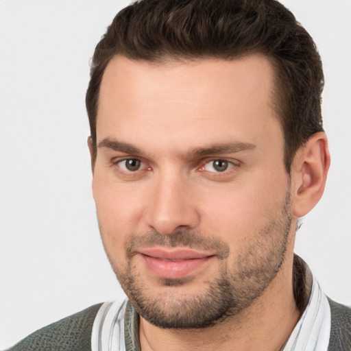 Joyful white young-adult male with short  brown hair and brown eyes