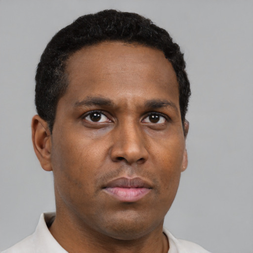 Neutral black young-adult male with short  black hair and brown eyes