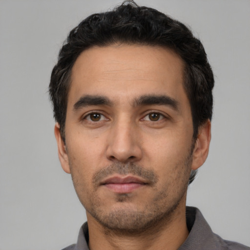 Neutral white young-adult male with short  black hair and brown eyes