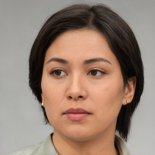 Neutral asian young-adult female with medium  brown hair and brown eyes