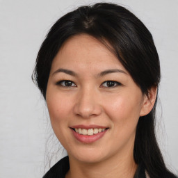 Joyful asian young-adult female with long  brown hair and brown eyes