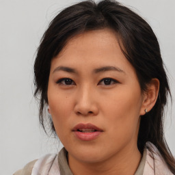 Neutral asian young-adult female with medium  brown hair and brown eyes