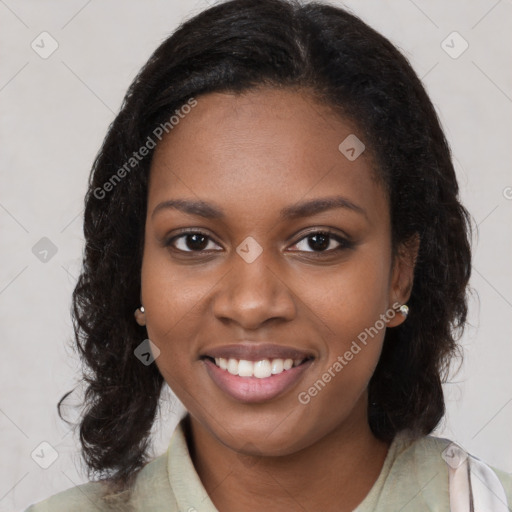 Joyful black young-adult female with medium  brown hair and brown eyes