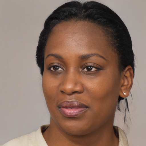 Joyful black young-adult female with medium  black hair and brown eyes