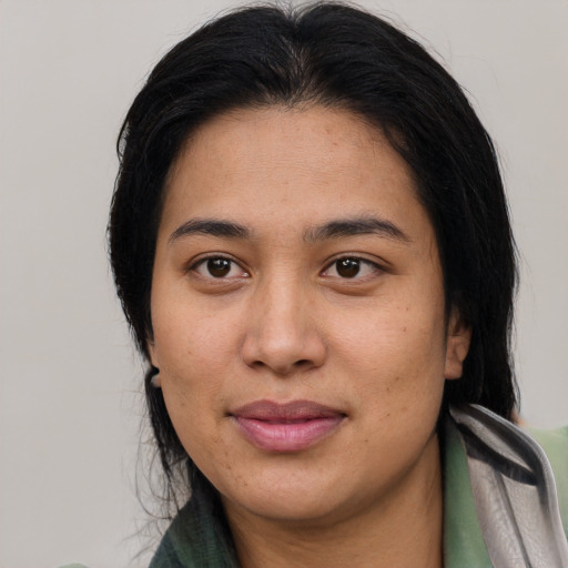 Joyful asian young-adult female with medium  black hair and brown eyes
