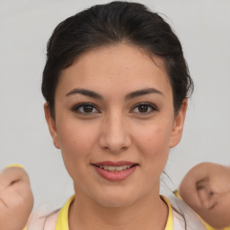 Joyful asian young-adult female with short  brown hair and brown eyes