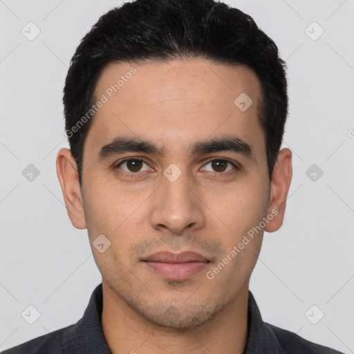 Joyful latino young-adult male with short  black hair and brown eyes