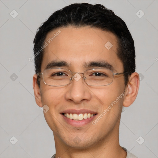 Joyful white young-adult male with short  black hair and brown eyes