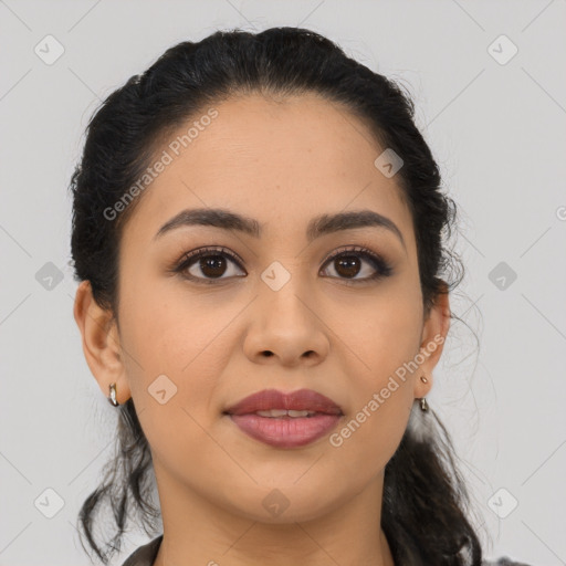 Joyful latino young-adult female with medium  black hair and brown eyes