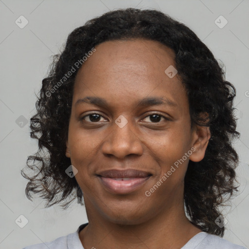 Joyful black young-adult female with medium  black hair and brown eyes