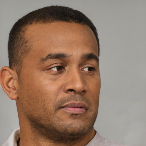 Neutral black young-adult male with short  brown hair and brown eyes