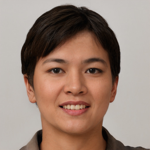 Joyful asian young-adult female with short  brown hair and brown eyes