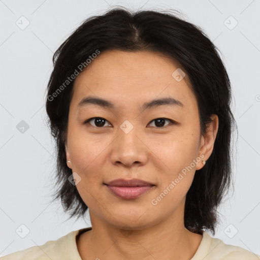 Joyful asian young-adult female with medium  brown hair and brown eyes