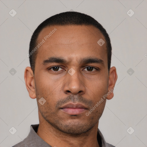 Neutral latino young-adult male with short  black hair and brown eyes