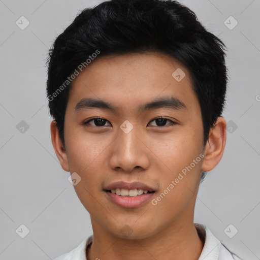 Joyful asian young-adult male with short  black hair and brown eyes