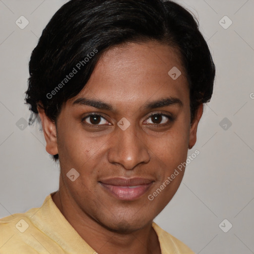 Joyful black young-adult male with short  black hair and brown eyes