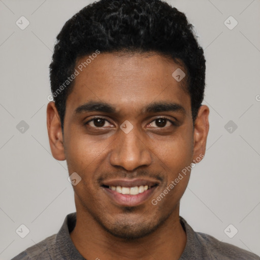 Joyful black young-adult male with short  black hair and brown eyes