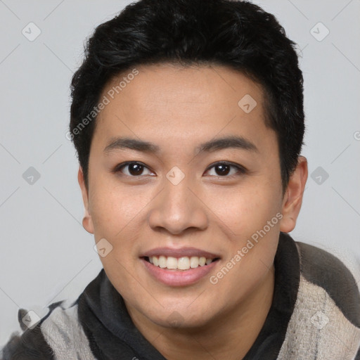 Joyful asian young-adult male with short  black hair and brown eyes