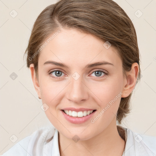 Joyful white young-adult female with medium  brown hair and blue eyes