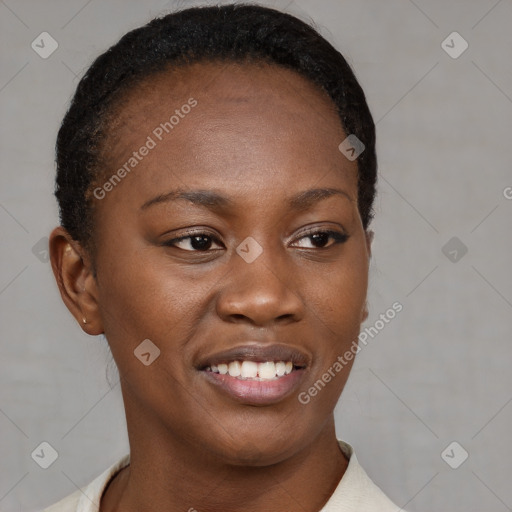 Joyful black young-adult female with short  brown hair and brown eyes