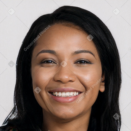 Joyful black young-adult female with long  black hair and brown eyes