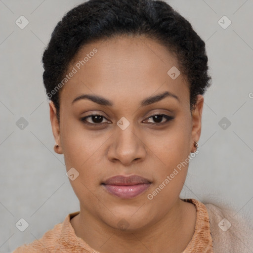 Joyful black young-adult female with short  brown hair and brown eyes