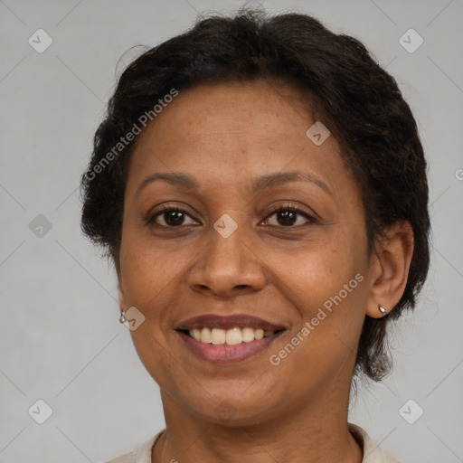 Joyful latino adult female with short  brown hair and brown eyes