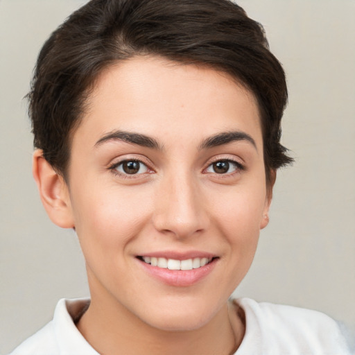 Joyful white young-adult female with short  brown hair and brown eyes