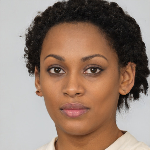 Neutral black young-adult female with short  brown hair and brown eyes