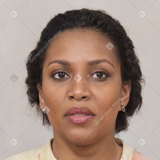 Joyful black young-adult female with medium  brown hair and brown eyes