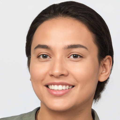 Joyful white young-adult female with medium  brown hair and brown eyes