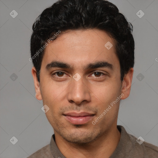 Joyful white young-adult male with short  black hair and brown eyes